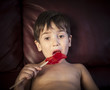 Boy Eating A Lollipop