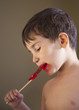 Boy Eating A Lollipop