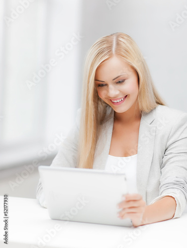 Photo: woman with tablet pc woman with tablet pc