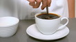 Video: Hand stirring cup of coffee close up in slow motion Hand stirring cup of coffee close up in slow motion