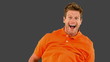 Handsome man jumping on grey screen in slow motion