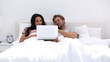 Attractive couple using the laptop together