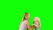 Mother lifting and spinning her daughter on green screen