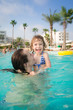 Family in swimming pool