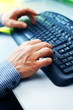 Photo: Closeup image of male hands typing Closeup image of male hands typing