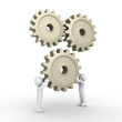 Two persons attach cogwheel