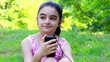 Girl listening to music on a smartphone