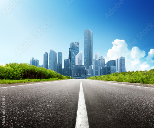 Photo: Asphalt road and modern city Asphalt road and modern city