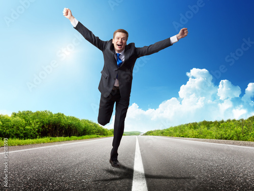 Photo: business man run on the road business man run on the road