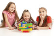 Children playing a toy house