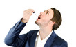 Young man dropping medicine or drug treatment with dropper