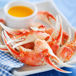 Boiled crab claws with orange sauce, selective focus