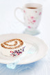 Photo: Slice of roll cake with tea and dried flower petals Slice of roll cake with tea and dried flower petals