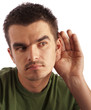 Photo: Young man eavesdropping Young man eavesdropping