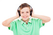 Photo: Portrait of smiling young boy listening to music on headphones a Portrait of smiling young boy listening to music on headphones a