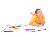 Photo: Dreaming boy lying on the floor and drawing with colorful pencil Dreaming boy lying on the floor and drawing with colorful pencil