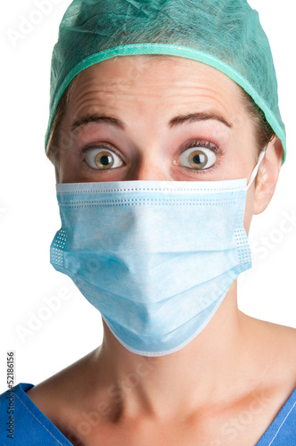 Photo: Surprised Female Surgeon with face mask Surprised Female Surgeon with face mask