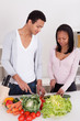 Photo: Couple Chopping Vegetables Couple Chopping Vegetables