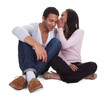 Foto: Woman Whispering To Boyfriend's Ear Woman Whispering To Boyfriend's Ear