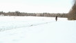 female cowboy rides a horse at a gallop in winter