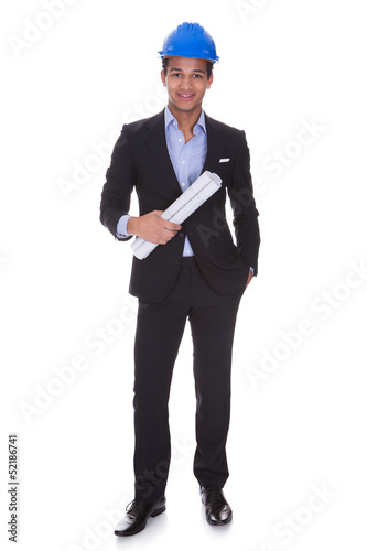 Photo: Young Male Engineer Holding Blueprint Young Male Engineer Holding Blueprint