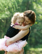 Girl and her mother are relaxing in the park