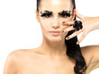 Photo: Woman with golden nails and style makeup Woman with golden nails and style makeup