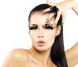 Photo: Woman with golden nails and style makeup Woman with golden nails and style makeup