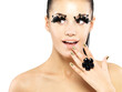 Photo: Woman with golden nails and style makeup Woman with golden nails and style makeup