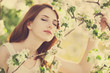 Girl near blossom tree