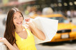 Happy Shopper Holding Shopping...