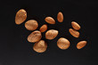 Foto: almond on black background almond on black background