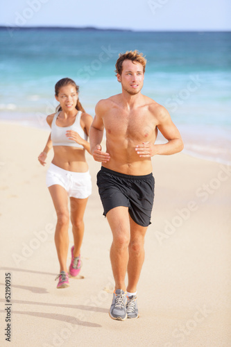 Photo: Couple running - man fitness runner first Couple running - man fitness runner first