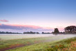 Photo: fog over summer meadow in sunrise fog over summer meadow in sunrise
