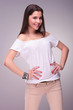 casual young woman with hands on hips