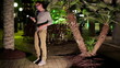 Male friends meeting in the night, in the city