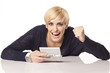 Girl with blond short hair plays on mini game computer