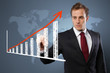 Photo: Man touching display with Chart Man touching display with Chart