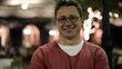 Portrait of young happy man in the night