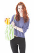 Happy woman put fruit in eco friendly cloth bag