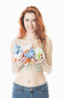 Smiling young woman recycling paper