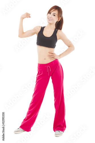 Photo: happy young fitness woman with muscle happy young fitness woman with muscle