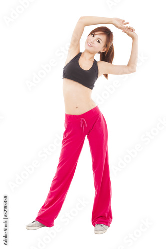 Photo: happy young woman doing stretch exercise happy young woman doing stretch exercise