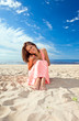 girl in pink dress on seacoast