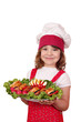 beautiful cheerful little girl cook with gourmet food