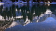 Reflection in clear water of the mountain lake.