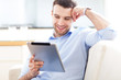 Photo: Man looking at digital tablet Man looking at digital tablet