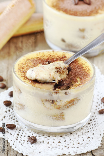Photo: Delicious Italian dessert Tiramisu in a glass bowl Delicious Italian dessert Tiramisu in a glass bowl