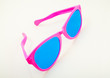 Carnival rose-colored glasses on a white background