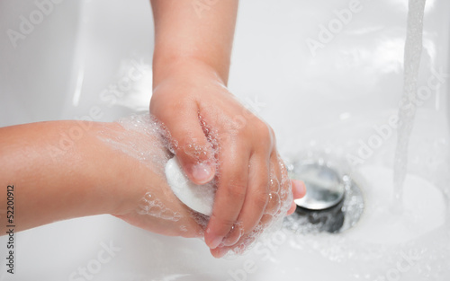 Photo: Child washing hands with soap Child washing hands with soap